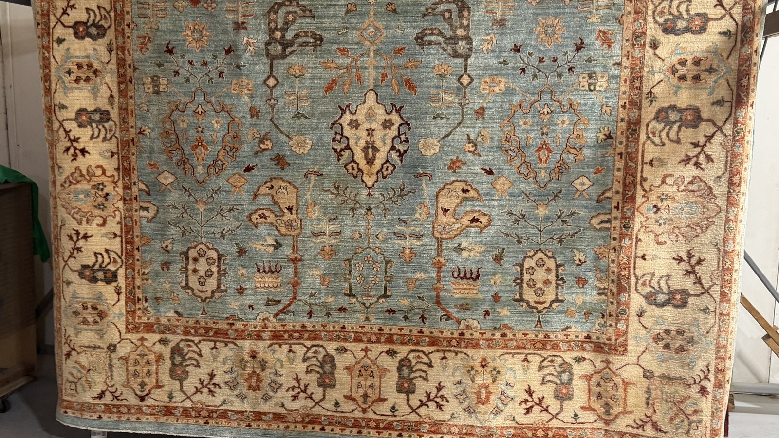 Clear water sheeting off a wool rug at the final flush stage